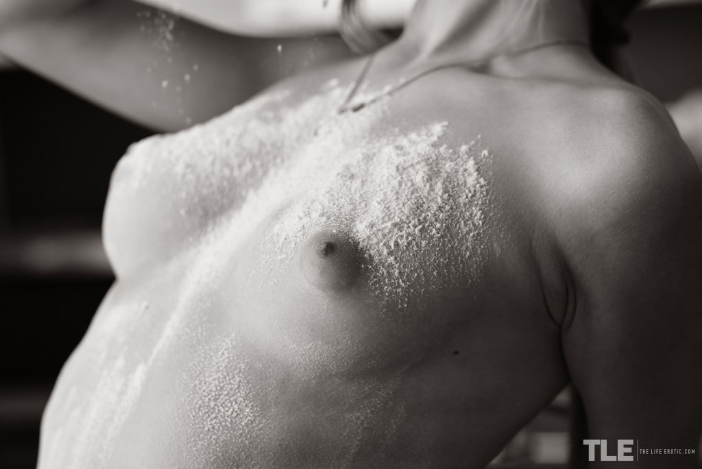 Naked teen Katia B covers her body in flour while in a kitchen