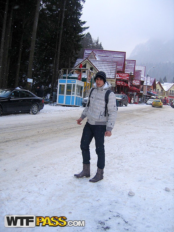 Amateur couple takes self shots while visiting a snow covered town