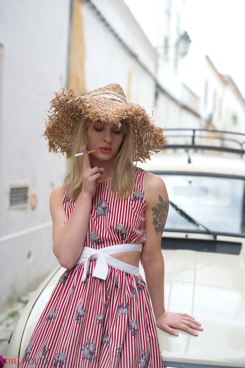 Blonde girl Pippa Doll exposes her underwear while in a vehicle