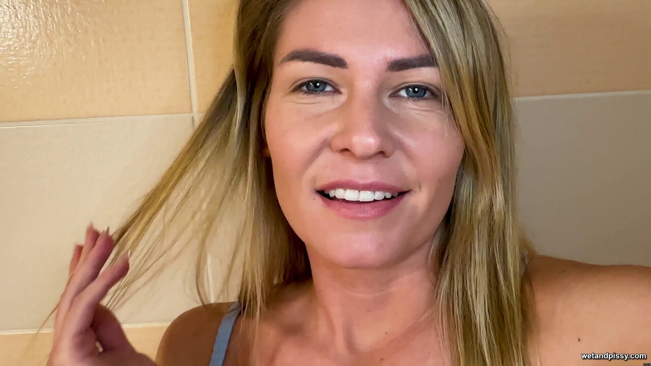 Blonde amateur Claudia Macc pisses while masturbating in a bathtub