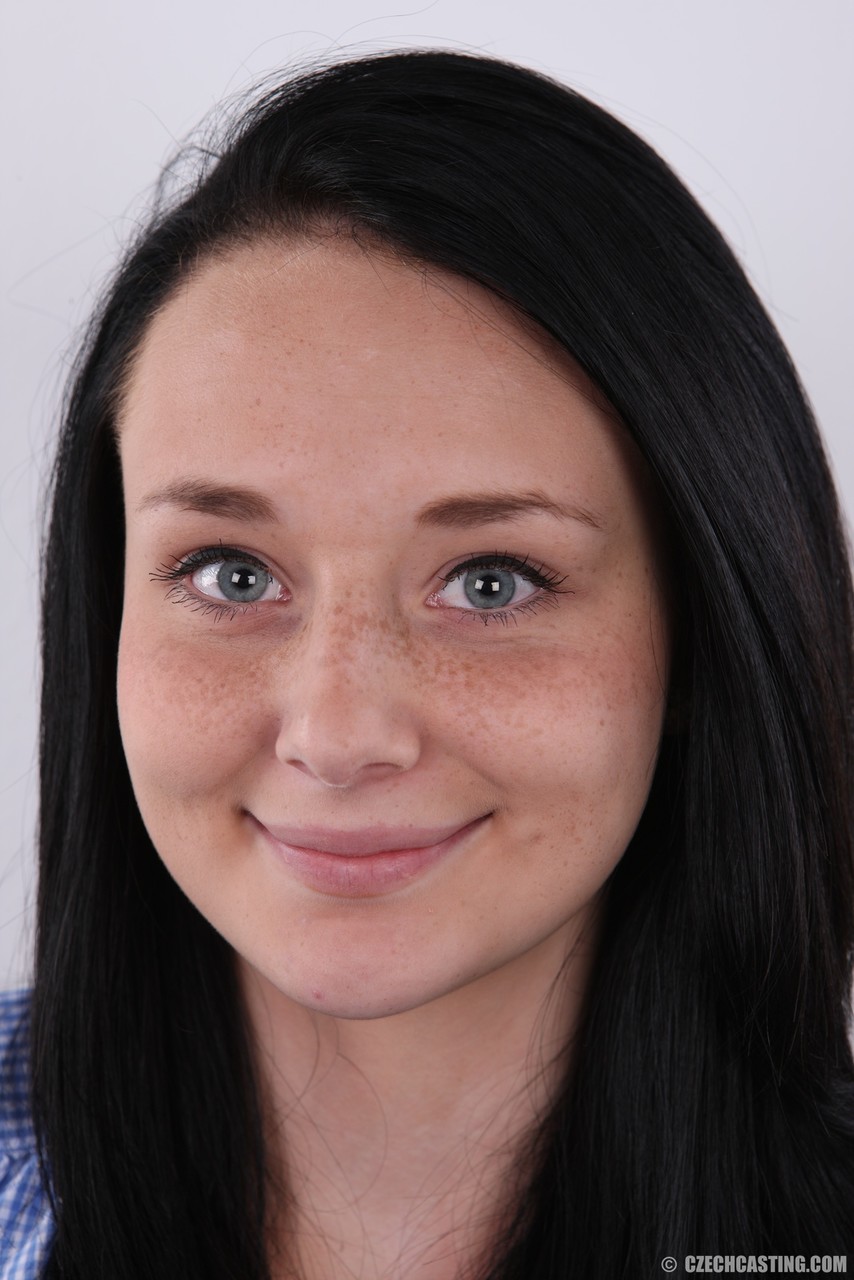 Dark haired amateur gets completely naked on a stool for a close up view