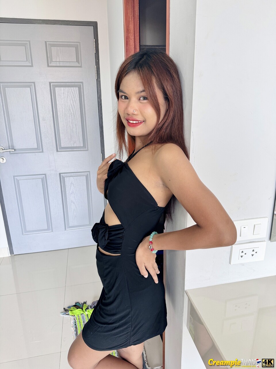 Petite Asian girl shows her small tits and her shaved puffy pussy