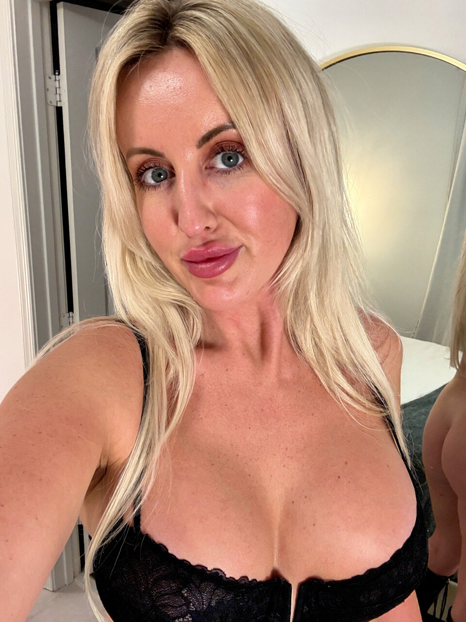 Sexy blonde with big boobs takes selfies in a variety of outfits