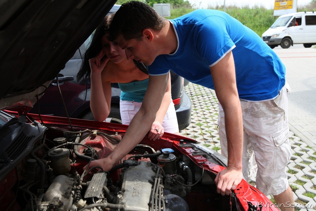 Dark haired teen has sex with a boy before they examine a broken down vehicle