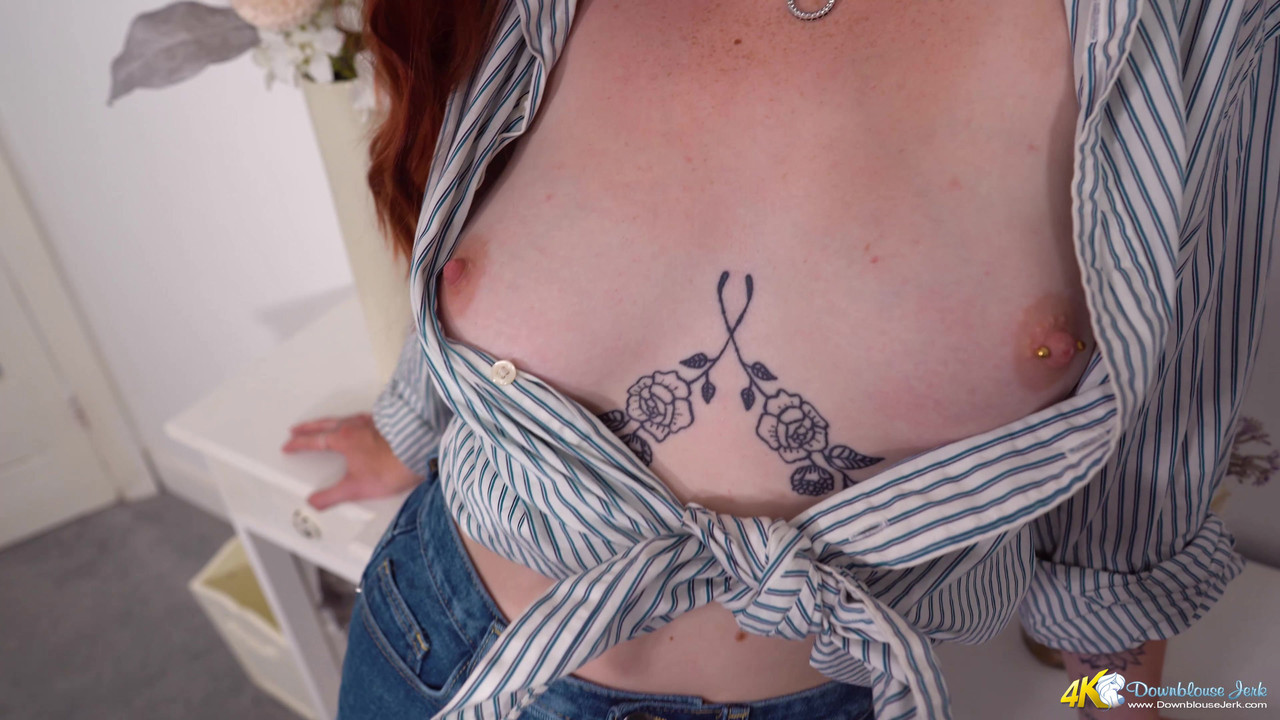 Redheaded British girl shows her pierced nipples while wearing jeans