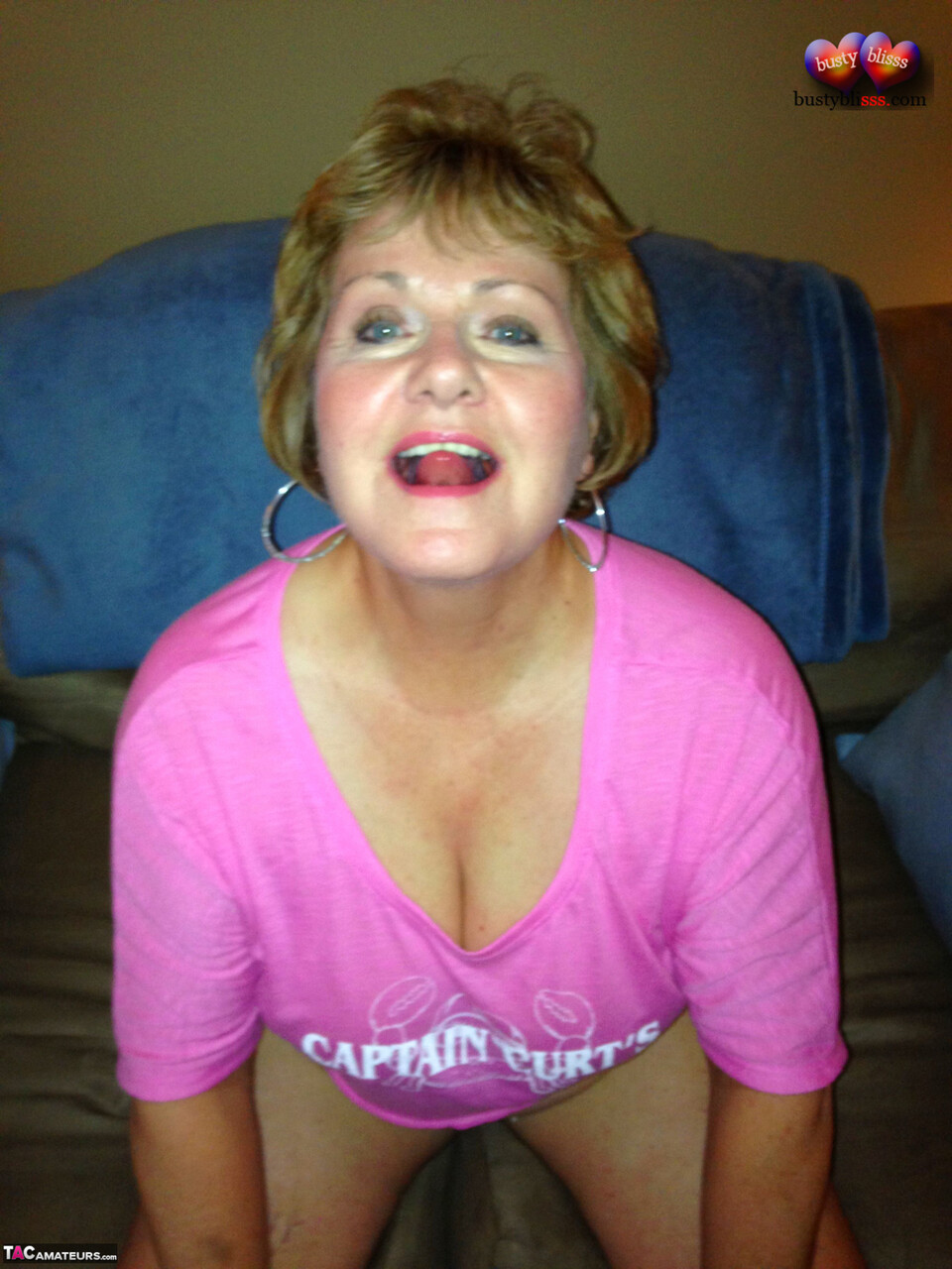 Mature woman Busty Bliss displays her saggy breasts before being fingered