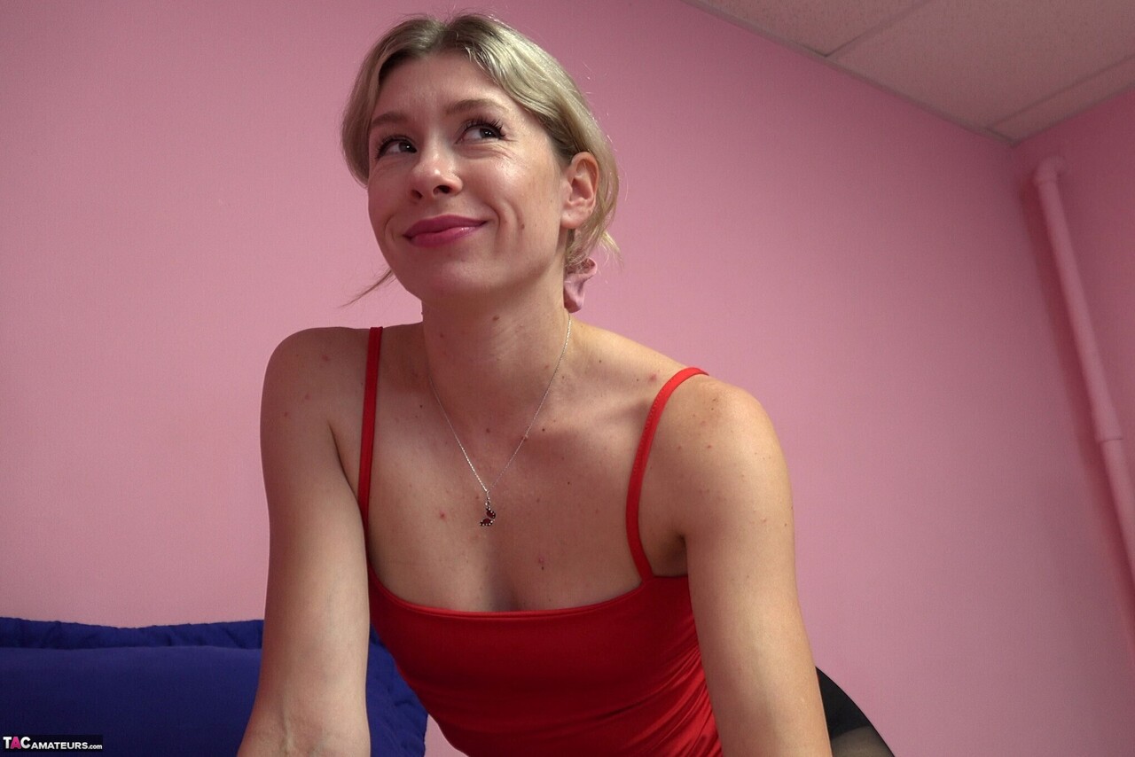 Blonde chick sticks her tongue out while sucking a cock in pantyhose