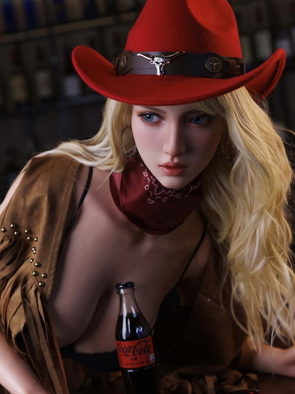 Sexy blonde doll dons a red cowboy hat while stripping to her boots