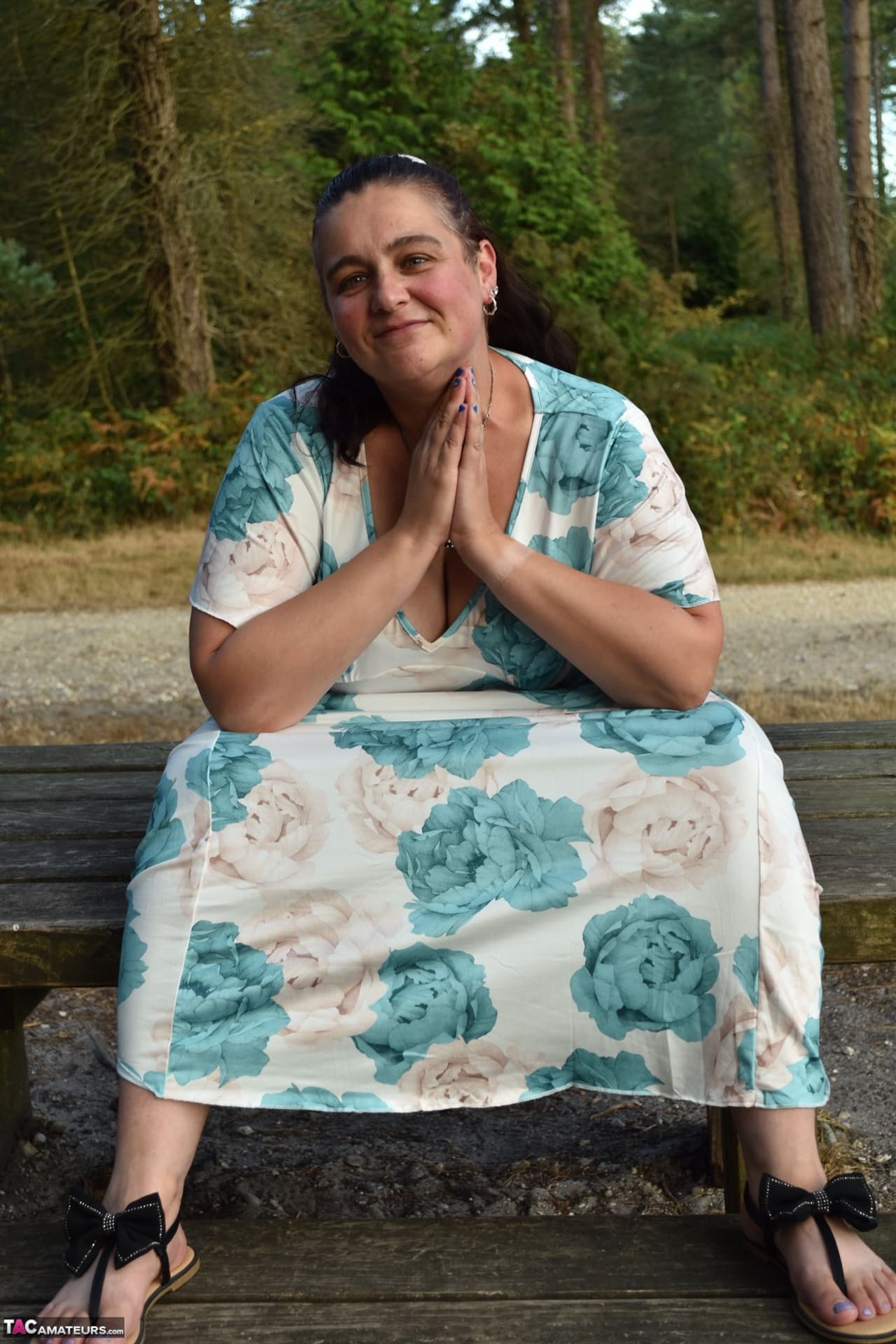 Mature BBW removes a dress before uncovering her natural tits in the woods