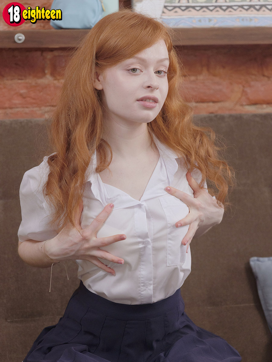 Young redhead removes her uniform to toy her pussy in white knee-high socks