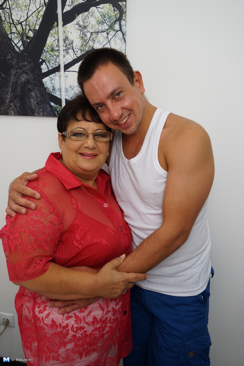 Old woman with glasses and big saggy tits gets banged by a younger man