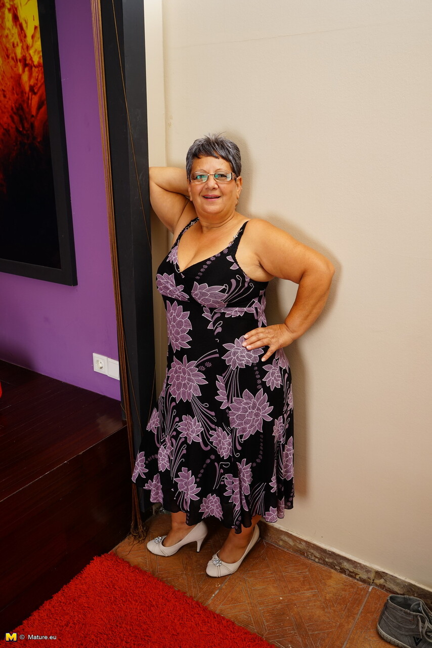 Older fatty slips out of her dress and heels to model naked in her glasses