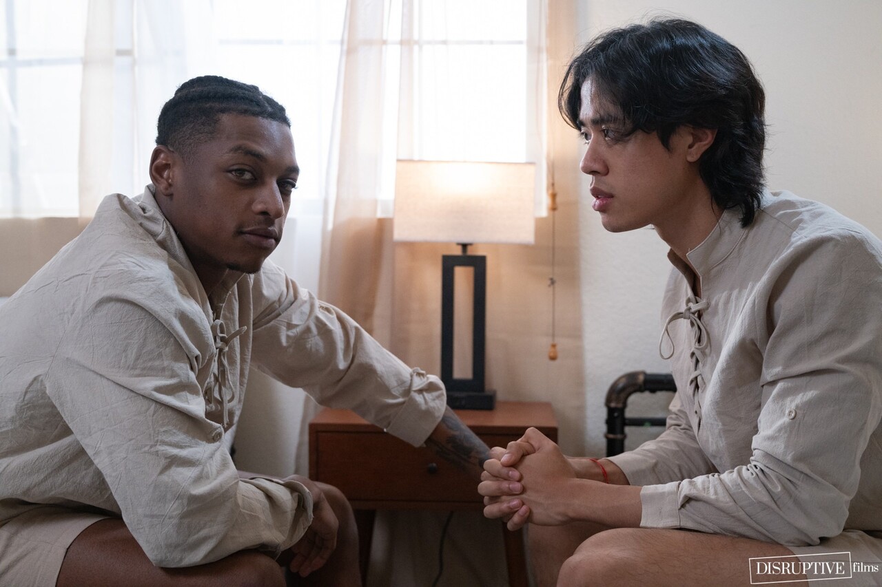 Gay boys have a threesome on a hotel bed with a Caucasian tourist