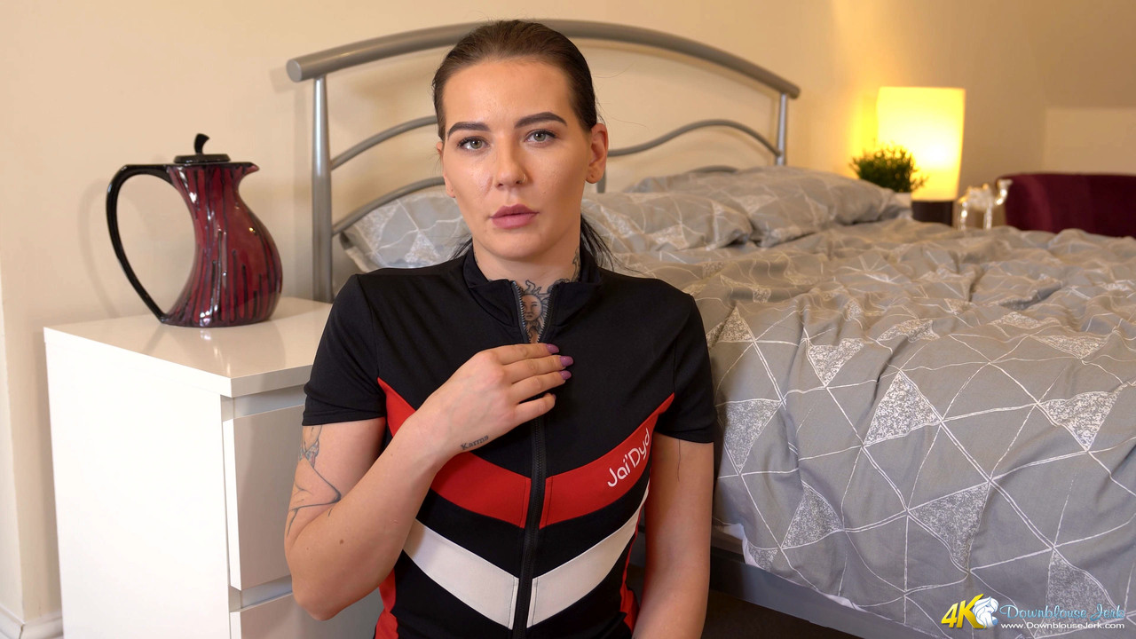 Tattooed amateur looses her natural tits from a black and red cycling jersey
