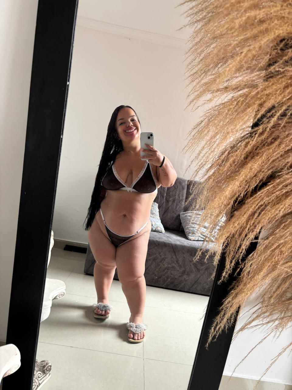 Latina amateur takes selfies of her large ass while wearing swimwear