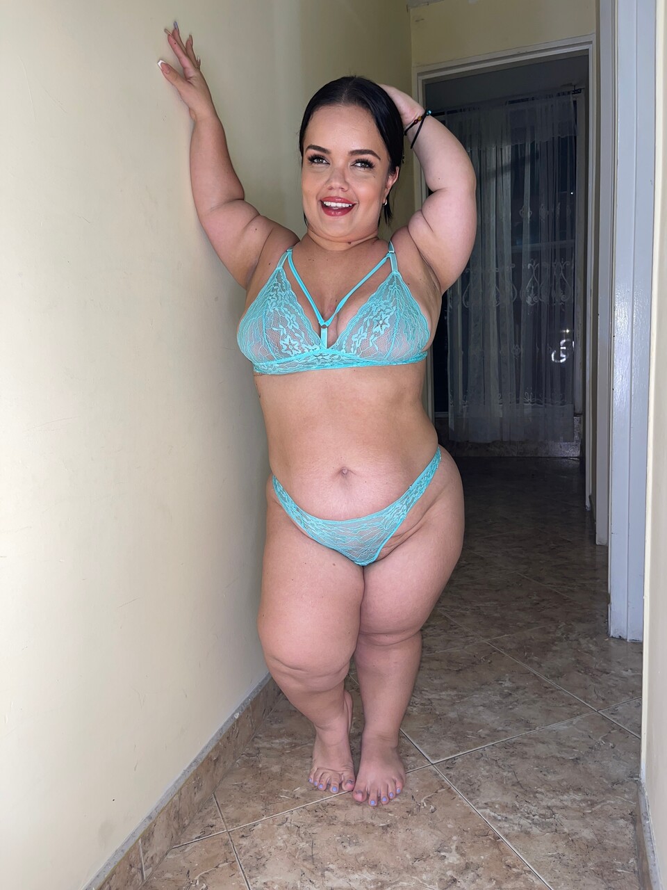 Chubby Latina teen models non nude in a bikini and bra and thong ensemble