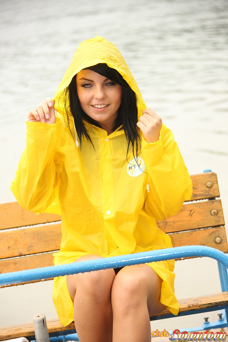Dark haired teen shows her tits and twat outdoors in the rain
