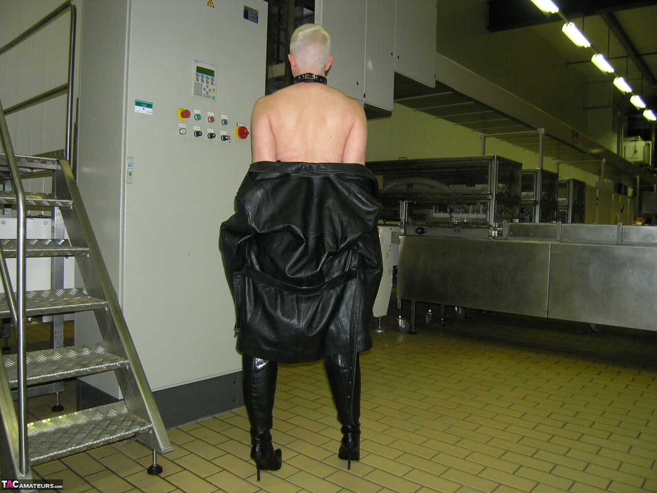 Blonde amateur Tiffany Pearl takes off her leather raincoat in a kitchen
