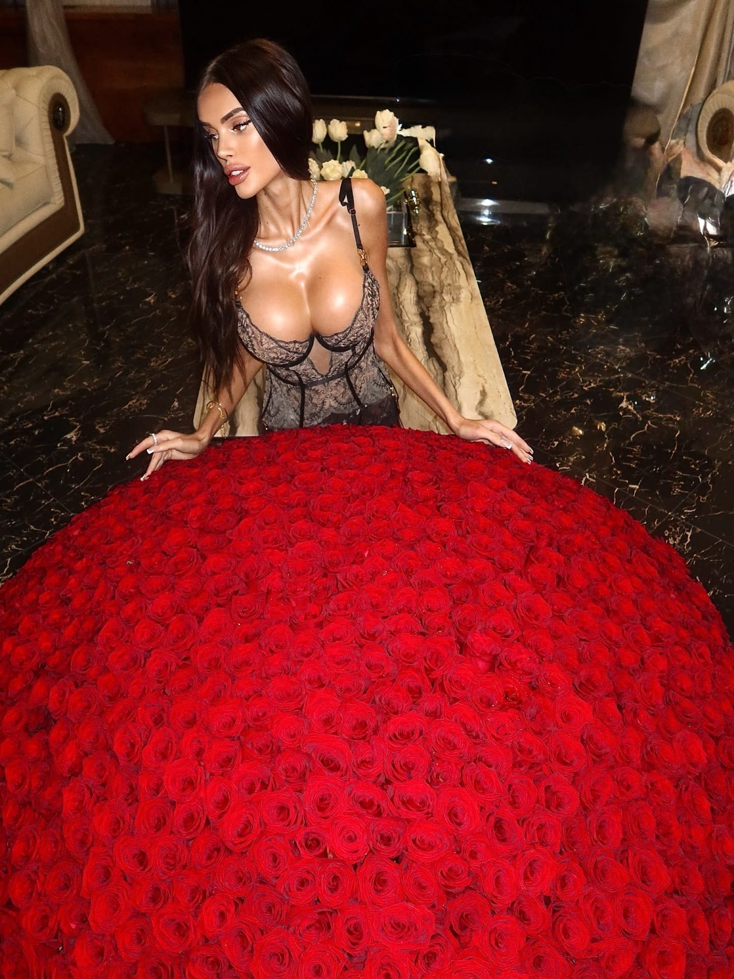 Leggy brunette with long hair flaunts her enhanced boobs in non-nude poses