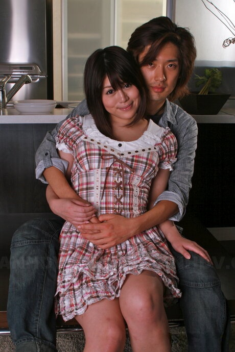 Japanese girl Alice Mizuno is restrained with handcuffs while on a leash