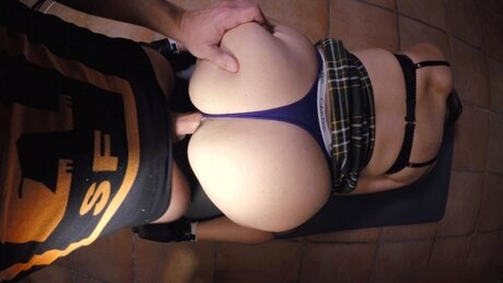 Blonde MILF takes a cumshot on her thong covered ass after a fuck