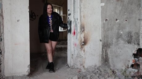 Brunette girl squats for a badly needed piss in an abandoned building