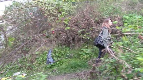 Redheaded girl Denisa spreads her legs while taking a piss on a dirt path