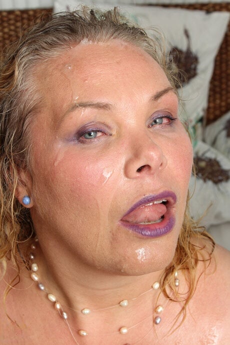 Mature blonde partakes in a double penetration with younger men