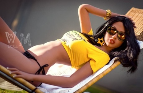 Solo girl touts her big boobs on the lawn while wearing shades