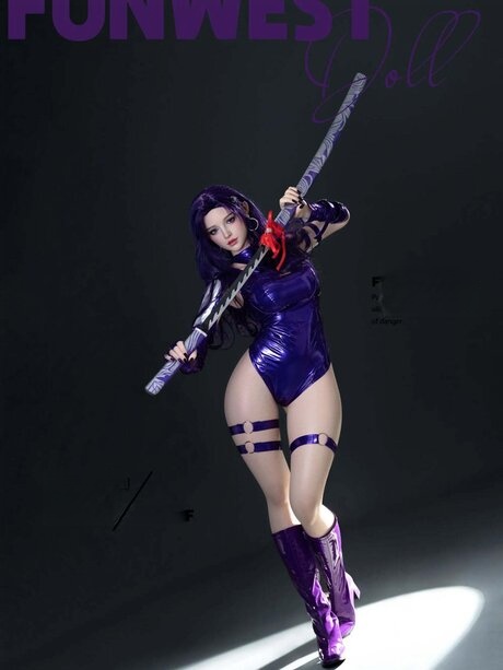Hot anime girl wields a swords in hot cosplay action posing in purple latex