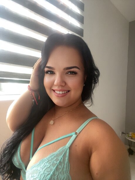 Chubby brunette teen takes selfies while wearing a thong and lace top