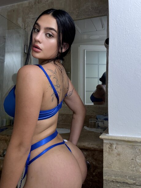 Solo girl with brunette hair models sexy lingerie during a self shoot session
